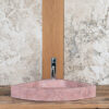Corner sink in pink travertine