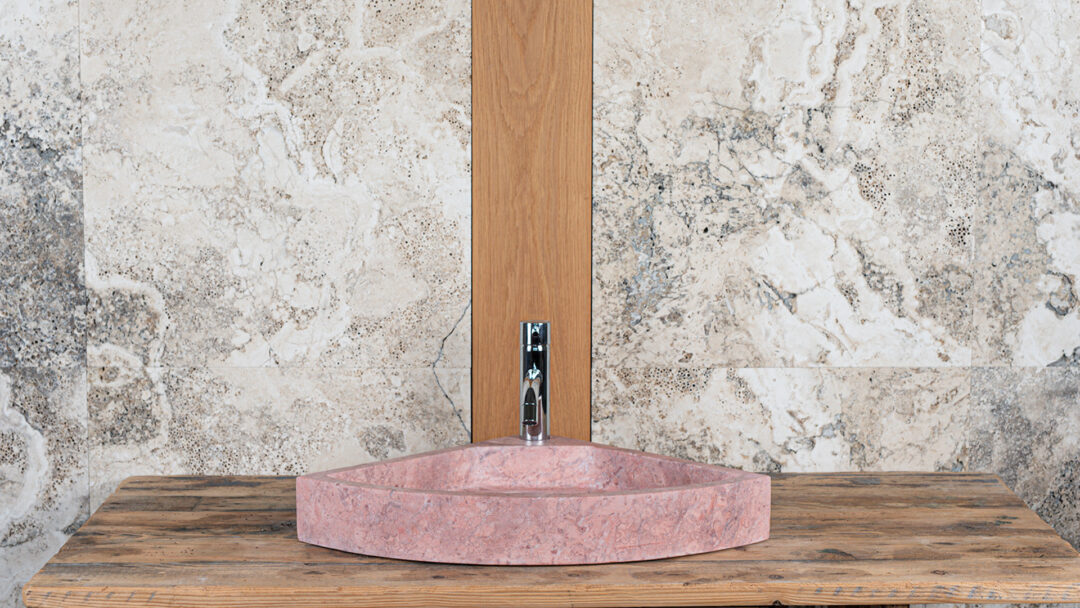 Corner sink in pink travertine