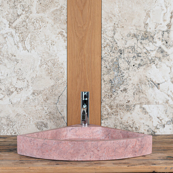 Corner sink in pink travertine