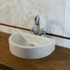Small crescent-shaped sink