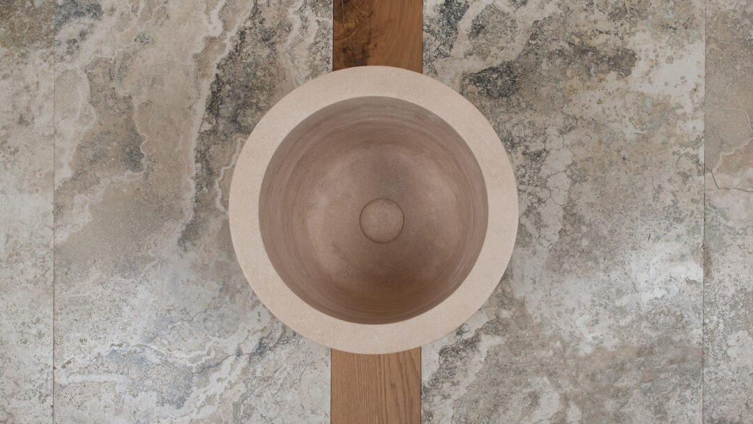 Tall light travertine Hammam sink viewed from above