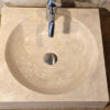 Small square countertop travertine sink