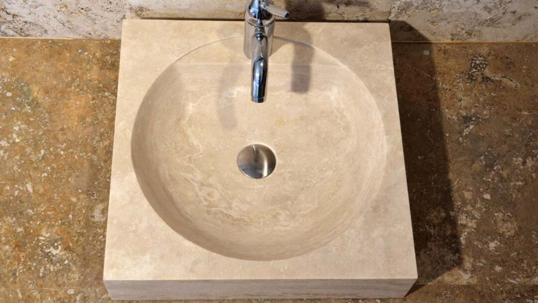 Small square countertop travertine sink
