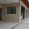 Rivestimento esterno con travertinco chiaro a spacco