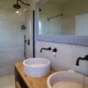 Crosscut travertine with matching sink