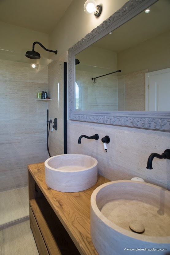 Crosscut travertine with matching sink