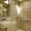 Bathroom cladding in Light Rapolano Stone