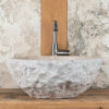Tondozzo: bathroom sink in white travertine with a rustic appearance