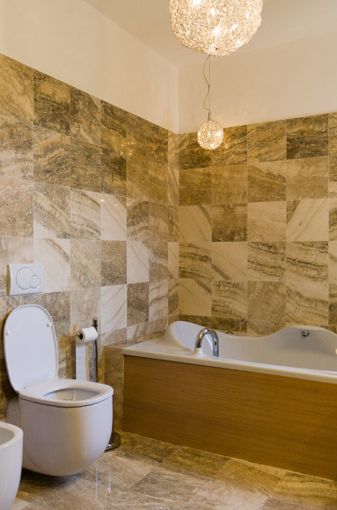 Bathroom tiles in cross-cut Zebra Royal travertine