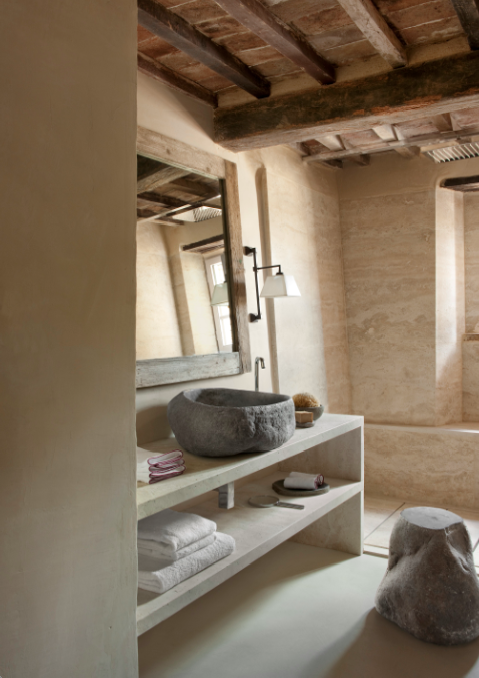 rustic shabby bathroom with countertop stone sink