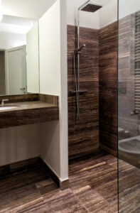 Pietre di Rapolano travertine zebra black bathroom Astrid